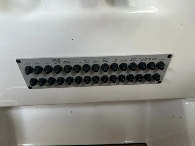 Slide: The Image of Control panel with various switches for boat functions, including GPS, stereo system, and lighting. - 27