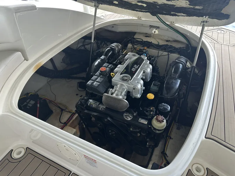 Slide: The Image of An open engine compartment of a 2011 Chaparral 287 SSX showing the engine and wiring. - 10