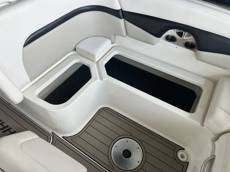 Slide: The Image of The image shows the interior of a 2011 Chaparral 287 SSX with white seating and flooring. - 8