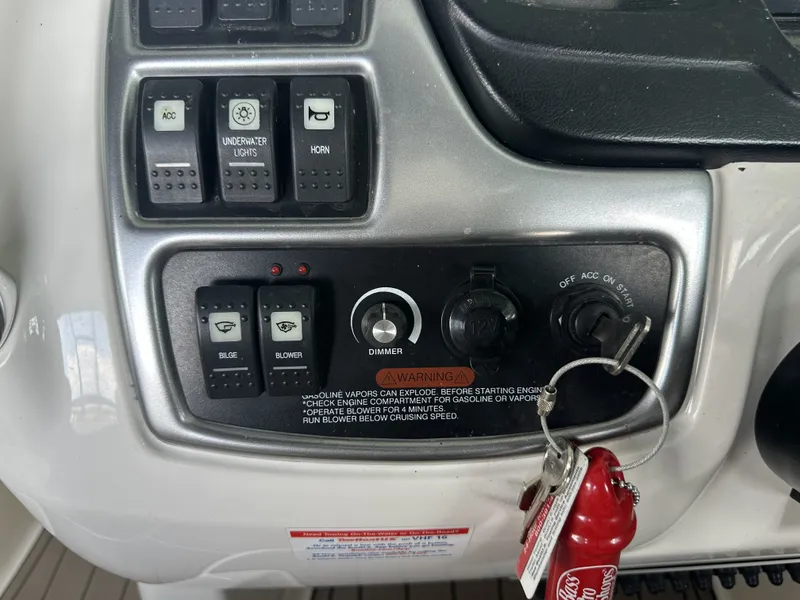 Slide: The Image of Close-up of a 2011 Chaparral 287 SSX helm with switches and ignition key. - 19
