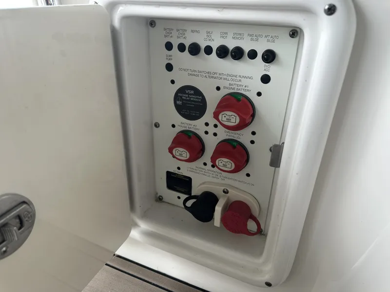 Slide: The Image of An electrical panel on a boat with various switches and connectors. - 9