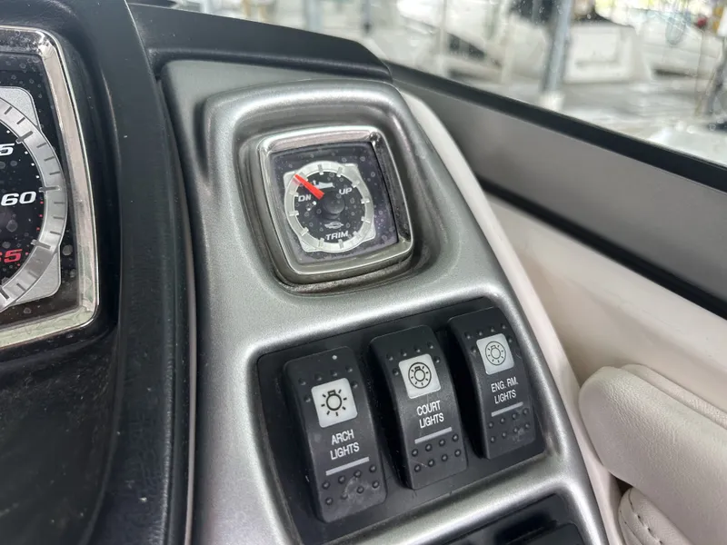 Slide: The Image of Close-up of a 2011 Chaparral 287 SSX dashboard with switches and a gauge. - 23