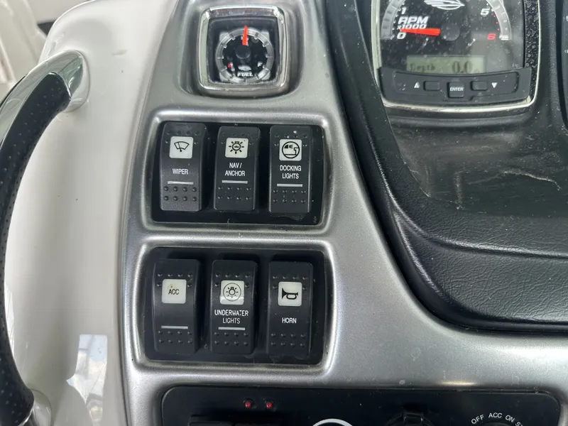 Slide: The Image of Close-up of a 2011 Chaparral 287 SSX helm with various switches and gauges. - 20