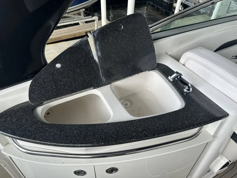 Slide: The Image of A sink with two basins and a faucet on a boat. - 13