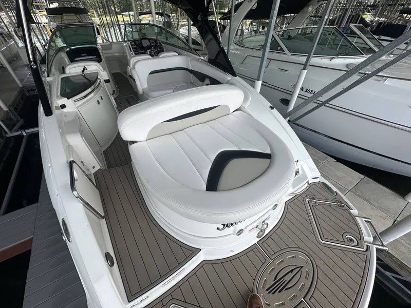 Slide: The Image of A 2011 Chaparral 287 SSX featuring sleek white seating and a modern cockpit. - 36