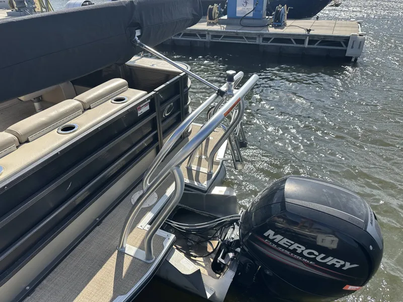 Slide: The Image of A 2017 Crest Classic 250SL CP3 with a Mercury outboard motor, docked at a pier. - 26