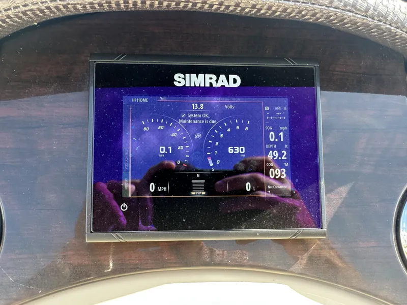 Slide: The Image of A Simrad display shows boat information such as speed and engine data. - 20