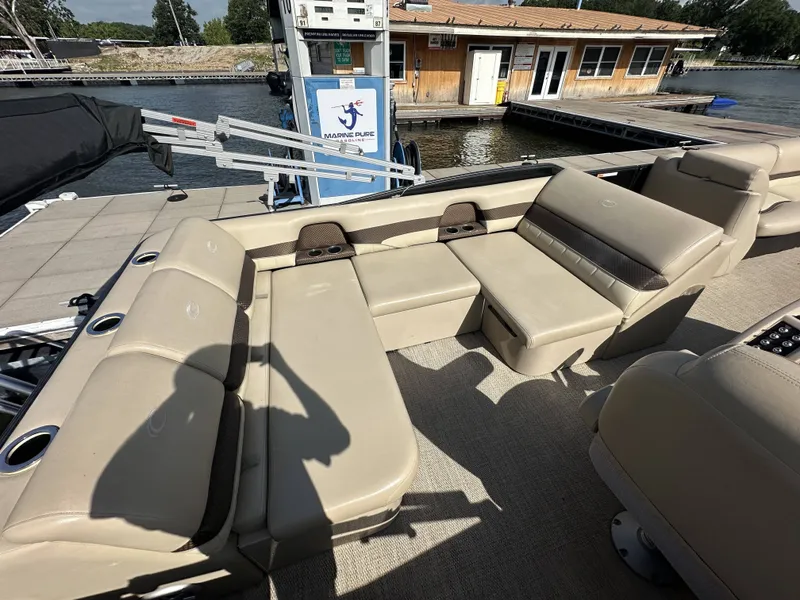 Slide: The Image of The image shows the spacious cockpit of a 2017 Crest Classic 250SL CP3 with beige seating. - 9