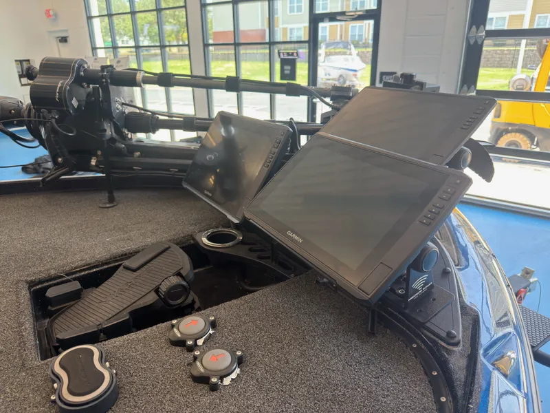 Slide: The Image of The image shows the cockpit of a 2023 Nitro Z20 boat with modern screens and controls. - 14