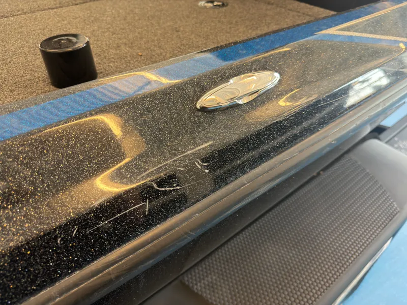 Slide: The Image of Close-up of a shiny boat deck with a logo and textured flooring. - 27