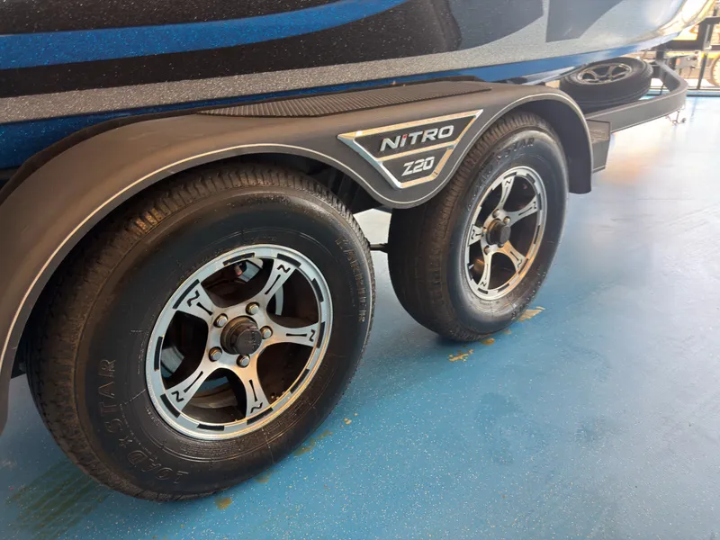 Slide: The Image of Close-up of a boat trailer with two tires, displaying the Nitro Z20 logo. - 22
