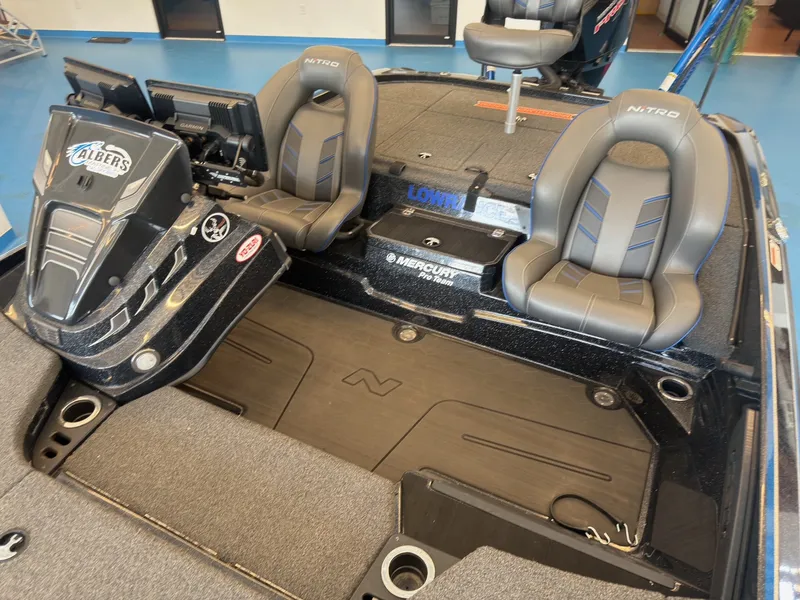 Slide: The Image of The image shows the cockpit of a 2023 Nitro Z20 boat with two padded seats and a helm. - 11