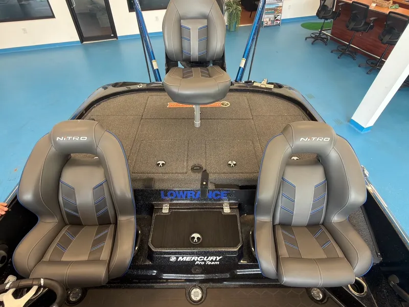 Slide: The Image of The image shows the cockpit of a 2023 Nitro Z20 boat with two padded seats and a Lowrance system. - 6