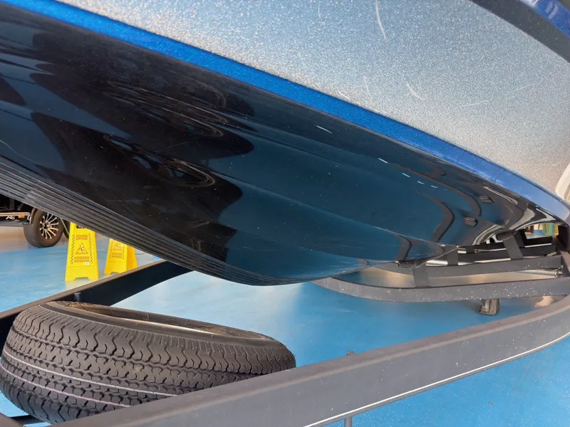 Slide: The Image of Close-up of a Nitro Z20 boat hull on a trailer, with a spare tire underneath. - 21