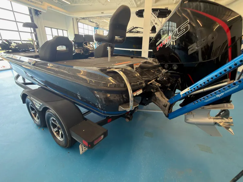 Slide: The Image of A 2023 Nitro Z20 boat on a trailer in a showroom. - 5