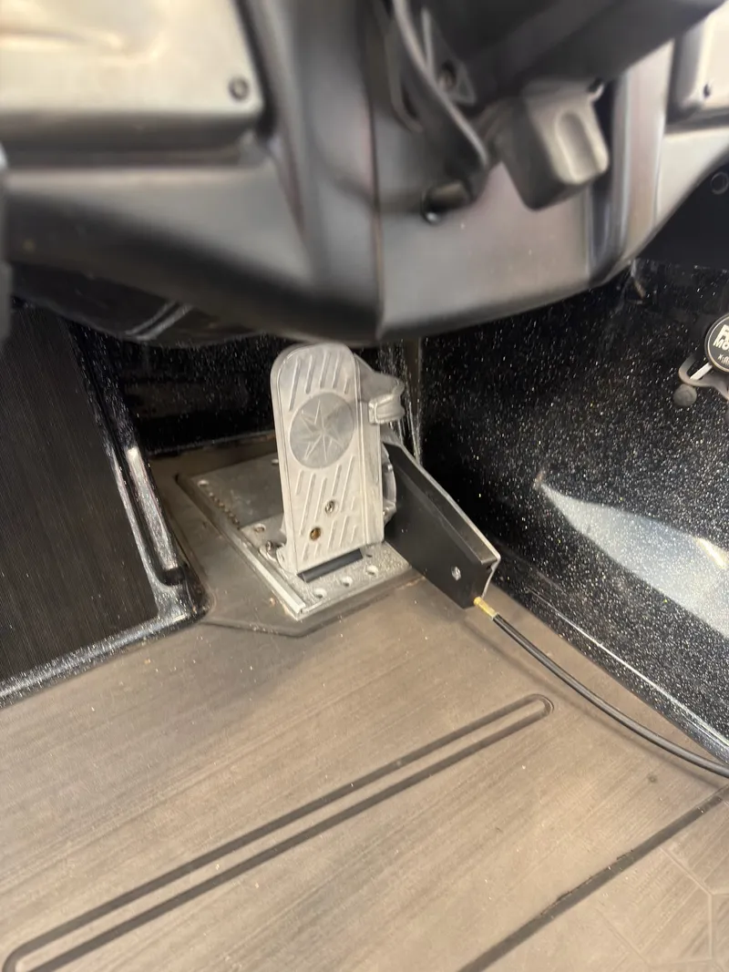 Slide: The Image of The image shows a pedal in the cockpit of a 2023 Nitro Z20 boat. - 15