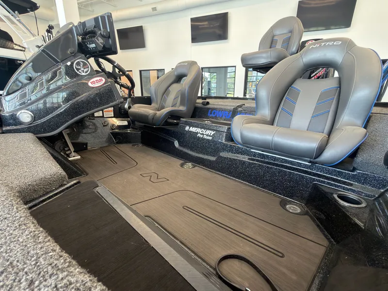 Slide: The Image of The image shows the cockpit of a 2023 Nitro Z20 boat with two padded seats and a helm console. - 7
