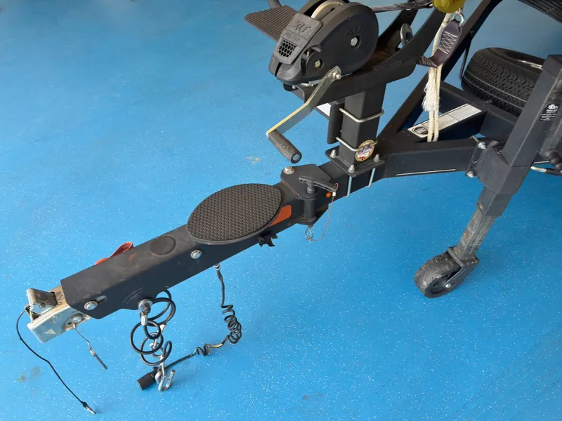 Slide: The Image of Close-up of a boat trailer hitch on a blue floor. - 26
