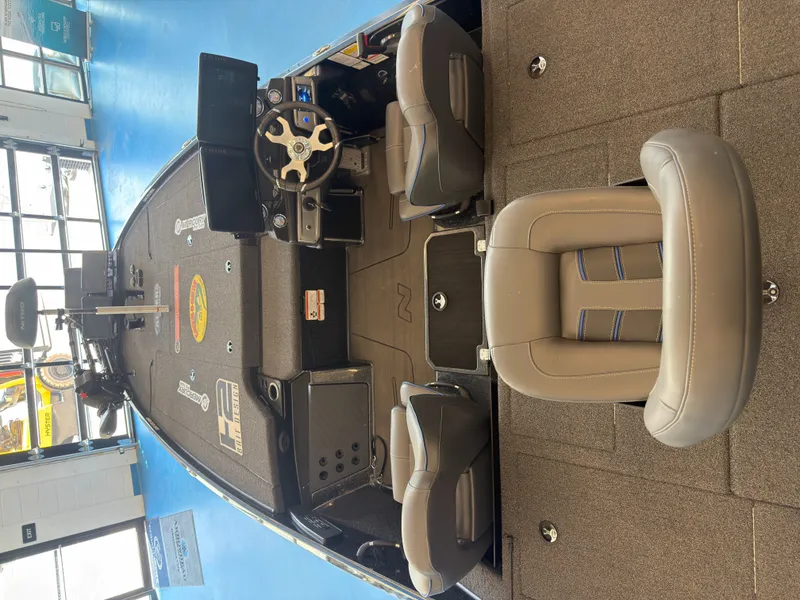 Slide: The Image of The image shows the interior of a 2023 Nitro Z20 boat with gray seats and a modern helm. - 10
