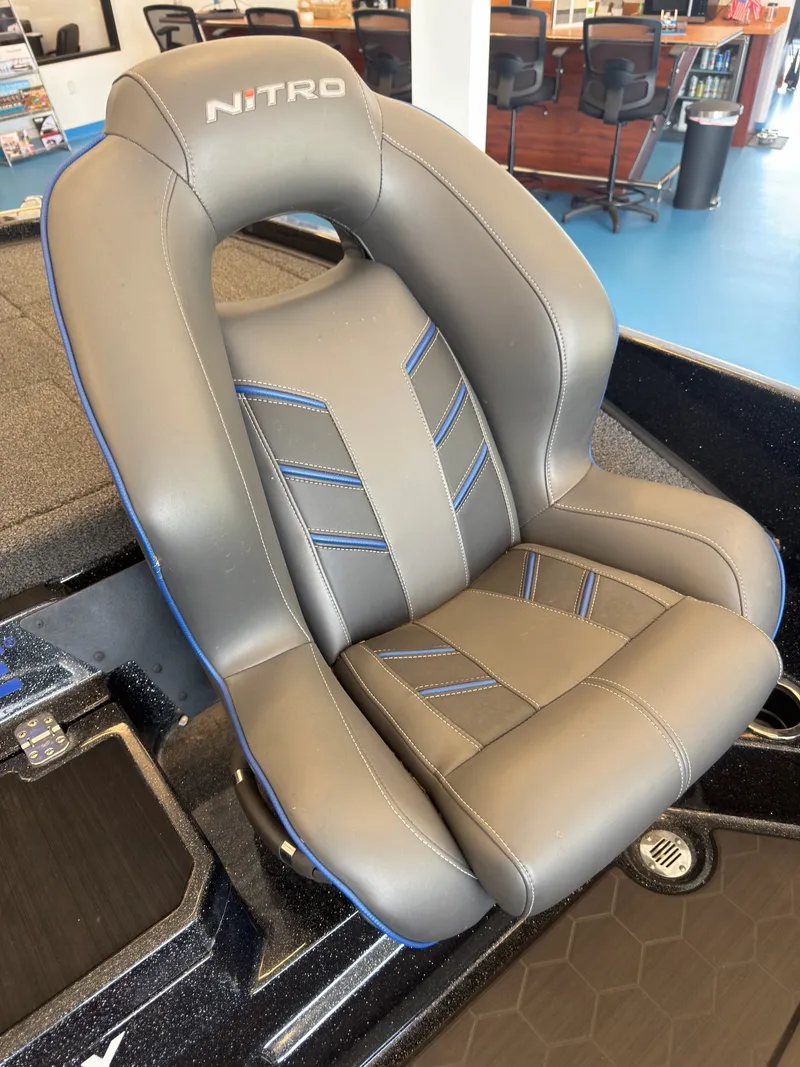 Slide: The Image of A gray boat seat with blue accents and the Nitro logo. - 13