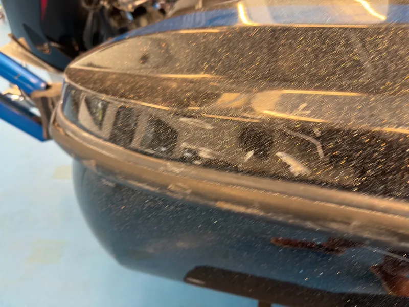 Slide: The Image of Close-up of the shiny hull of a 2023 Nitro Z20 boat. - 28