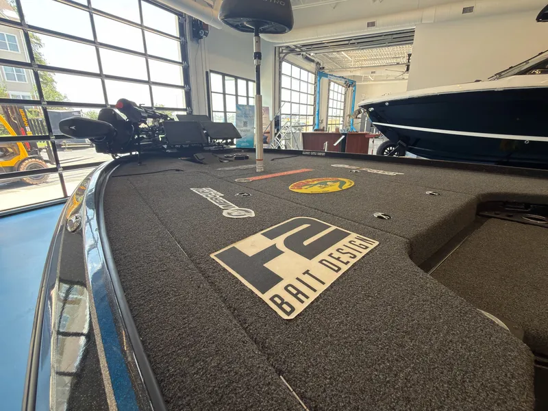 Slide: The Image of The image shows the deck of a 2023 Nitro Z20 boat in a showroom. - 20