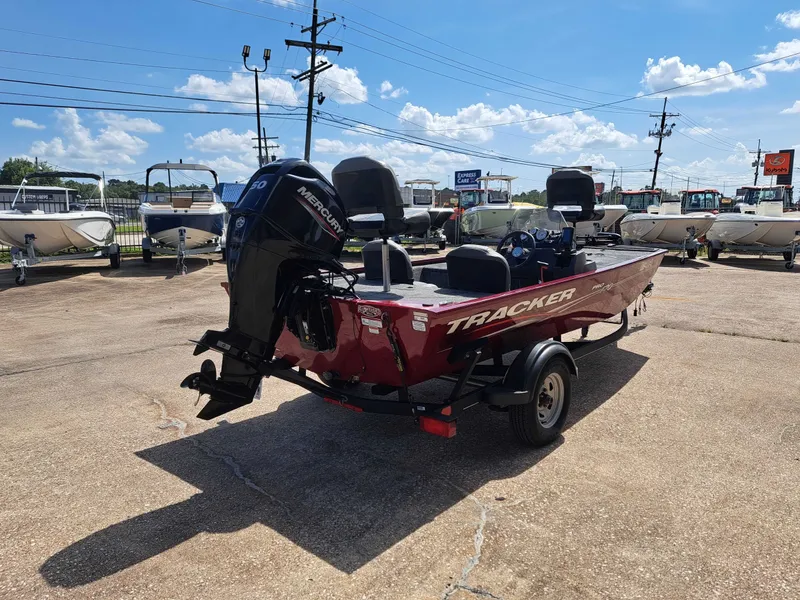 Slide: The Image of A red 2022 Tracker Pro 170 boat on a trailer in an outdoor area. - 10