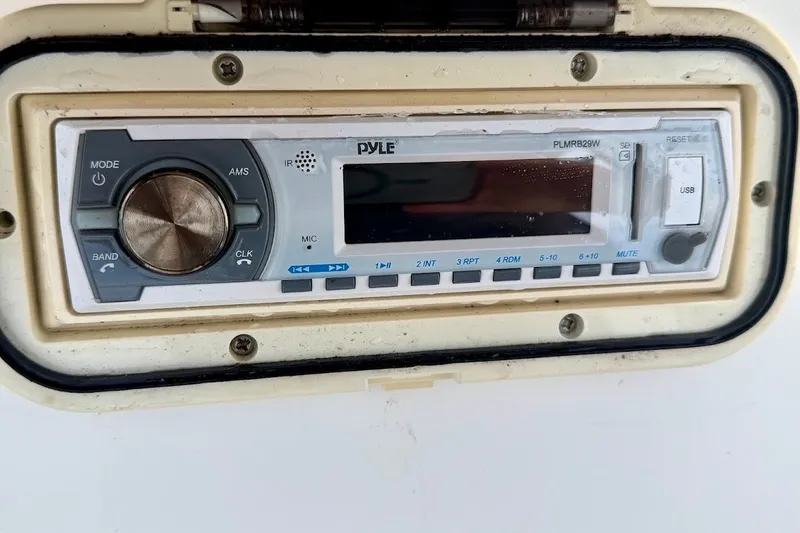 Slide: The Image of Boat stereo system on a 2016 Sportsman Island Bay 20, featuring Pyle PLMRB29W model. - 29