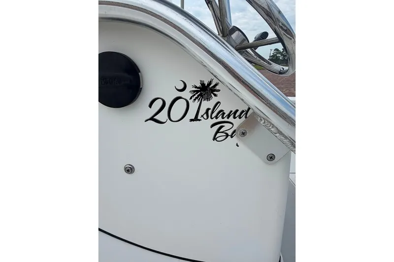 Slide: The Image of 2016 Sportsman Island Bay 20 boat dashboard with logo and steering wheel. - 16