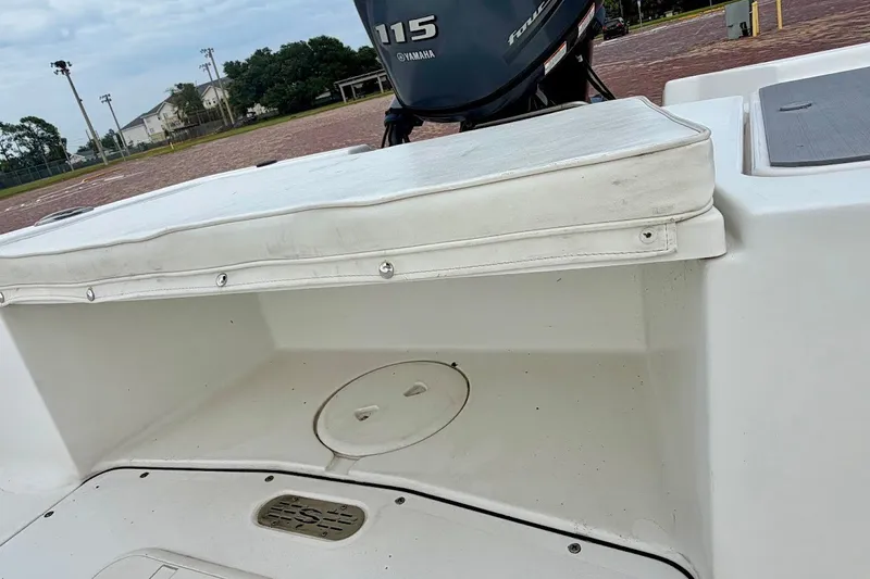 Slide: The Image of 2016 Sportsman Island Bay 20 boat with Yamaha 115 engine, featuring rear seating and storage. - 21