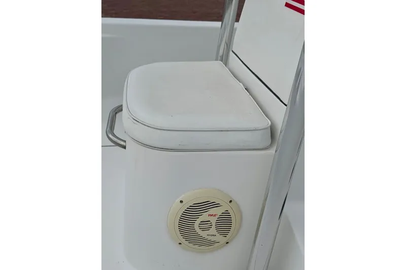 Slide: The Image of 2016 Sportsman Island Bay 20 boat seat with speaker, featuring white cushioned seating. - 25