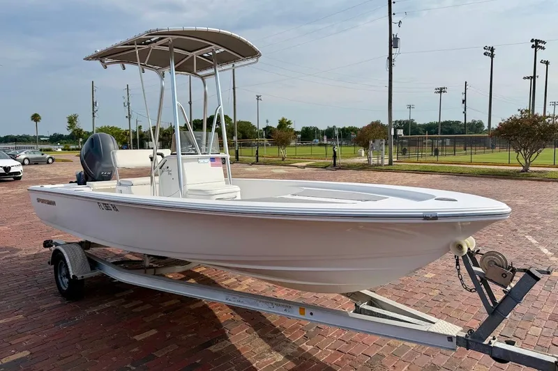 Slide: The Image of 2016 Sportsman Island Bay 20 boat on trailer in parking lot. - 2