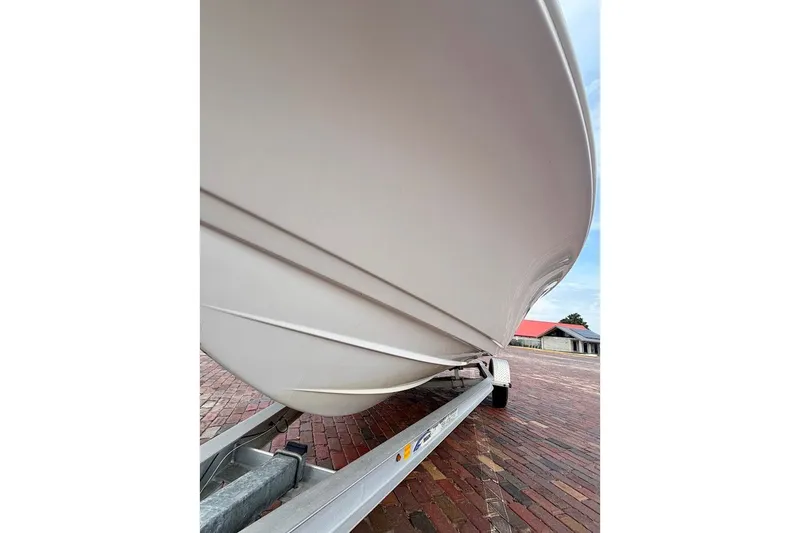 Slide: The Image of 2016 Sportsman Island Bay 20 boat on trailer, brick pavement background. - 5