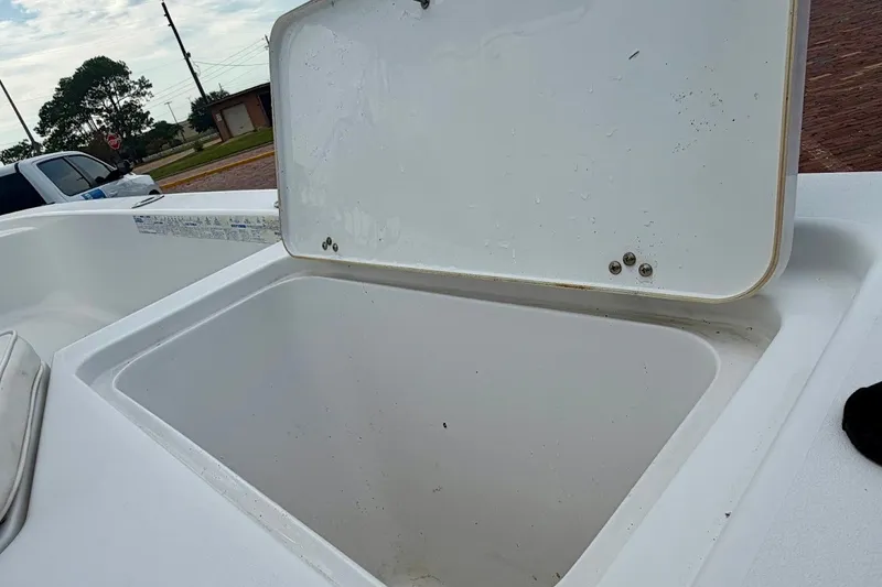 Slide: The Image of Open storage compartment on a 2016 Sportsman Island Bay 20 boat. - 18