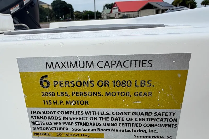 Slide: The Image of 2016 Sportsman Island Bay 20 boat capacity label, 6 persons or 1080 lbs, 115 HP motor. - 20