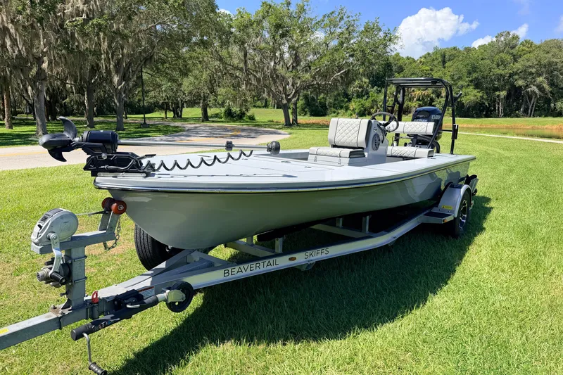Slide: The Image of 2019 Beavertail Skiffs Vengeance 18' boat on trailer, parked on grass. - 7