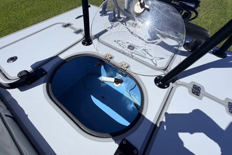 Slide: The Image of 2019 Beavertail Skiffs Vengeance 18' livewell with open lid, showcasing interior details. - 54
