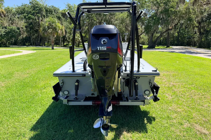 Slide: The Image of 2019 Beavertail Skiffs Vengeance 18' boat with 115 HP engine on grass. - 4