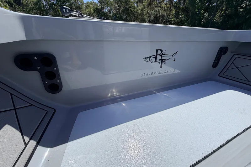 Slide: The Image of 2019 Beavertail Skiffs Vengeance 18' interior with logo and rod holders. - 27