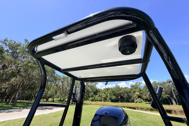 Slide: The Image of 2019 Beavertail Skiffs Vengeance 18' T-top with scenic outdoor background. - 63