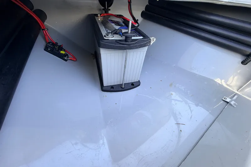 Slide: The Image of Battery setup in 2019 Beavertail Skiffs Vengeance 18' boat interior. - 26