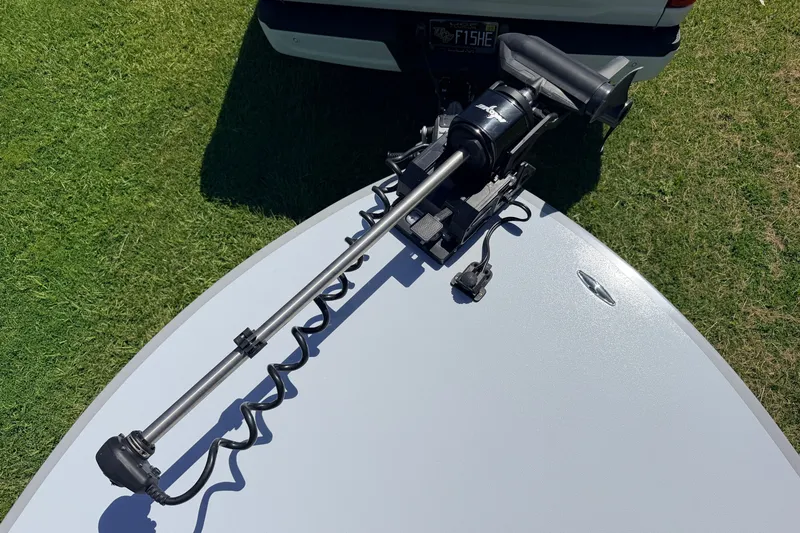 Slide: The Image of 2019 Beavertail Skiffs Vengeance 18' with trolling motor on grass. - 22