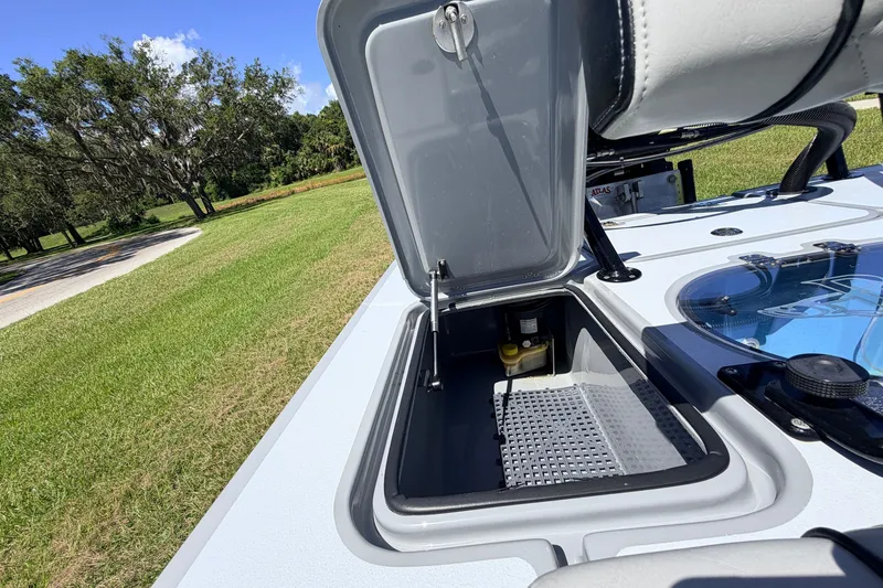 Slide: The Image of 2019 Beavertail Skiffs Vengeance 18' boat storage compartment open, showcasing interior details. - 51