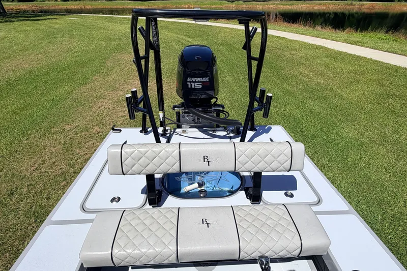 Slide: The Image of 2019 Beavertail Skiffs Vengeance 18' with Evinrude 115 engine, featuring cushioned seating. - 48
