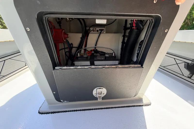 Slide: The Image of 2019 Beavertail Skiffs Vengeance 18' battery compartment with wiring and components. - 41
