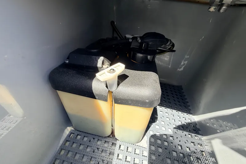 Slide: The Image of Battery compartment of 2019 Beavertail Skiffs Vengeance 18' boat, featuring secure storage. - 57