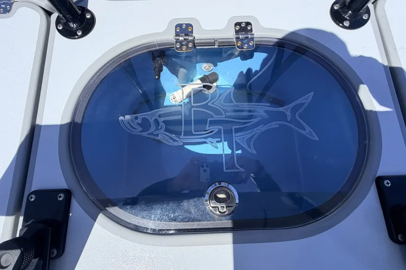 Slide: The Image of 2019 Beavertail Skiffs Vengeance 18' livewell with logo, featuring a fish design. - 53