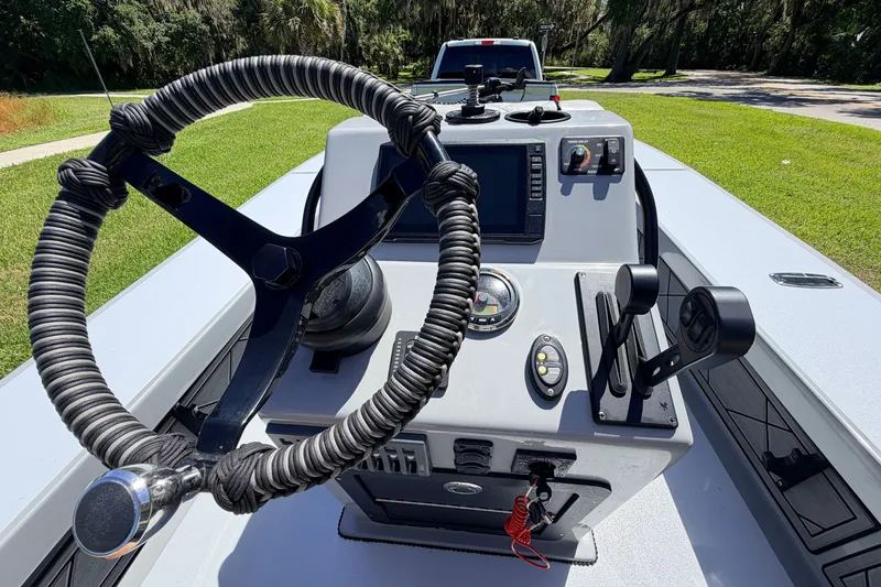 Slide: The Image of 2019 Beavertail Skiffs Vengeance 18' boat console with steering wheel and controls. - 36