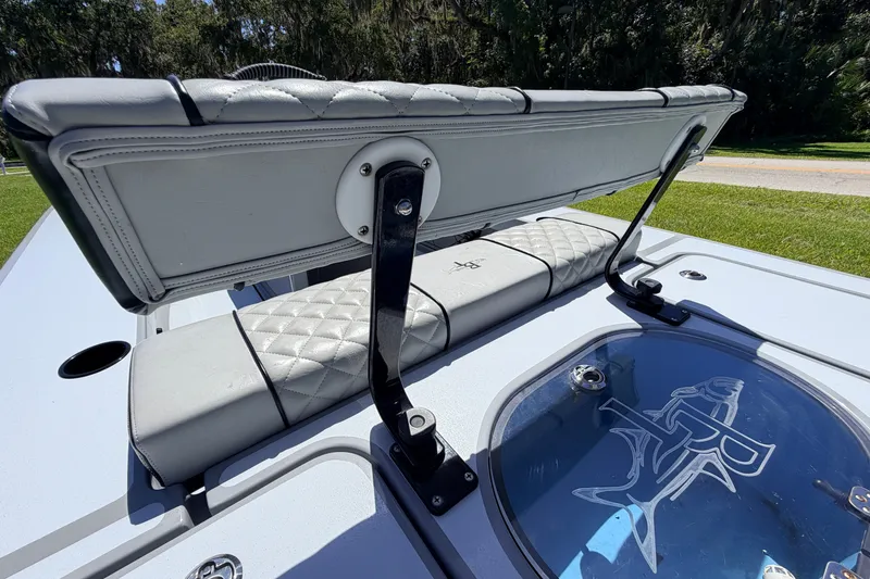 Slide: The Image of 2019 Beavertail Skiffs Vengeance 18' boat interior with cushioned seating and livewell. - 60
