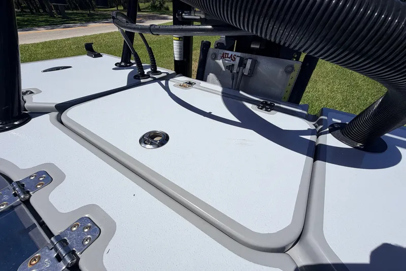 Slide: The Image of 2019 Beavertail Skiffs Vengeance 18' deck with hatches and hardware in sunlight. - 58